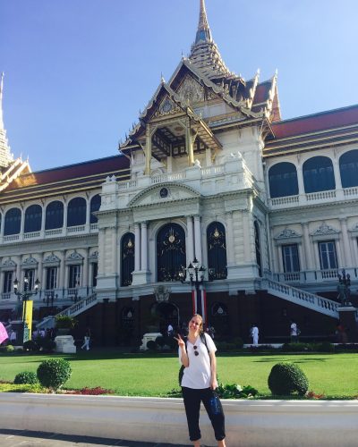 Amy Kobelt standing in front of the Grand Palace in Bangkok, Thailand
