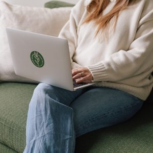 Amy Kobelt working on her computer using the Jane App at her private practice.